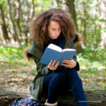 image of girl reading one of the Best books for Highschool Seniors from Arise Home Education