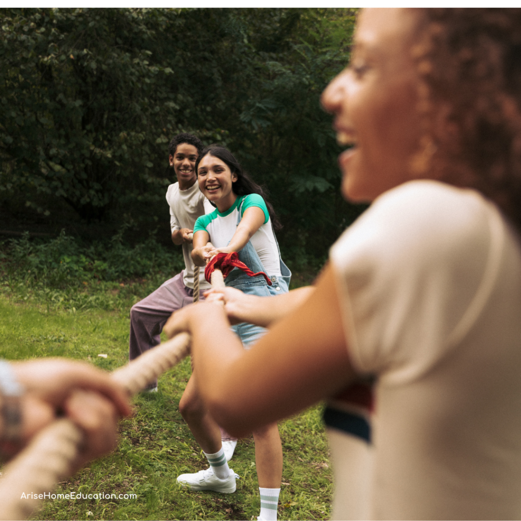 image of teens in tug or war. Debate Questions for Teens from AriseHomeEducation.com