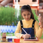 image of girl with science equipment and tablet, using maths skills for high school science at AriseHomeEducation.com