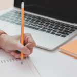 image of person writing for high school English iGCSE