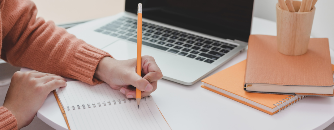 image of person writing for high school English iGCSE
