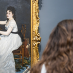 image of woman looking at art in a museum as part of Art History Curriculum for Teens class at Arise Home Education