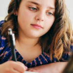 image of girl writing for KS3 english Language for Home Education at AriseHomeEducation.com