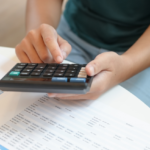 image of person using calculator in IGCSE Accounting Class for Teens at AriseHomeEducation.com