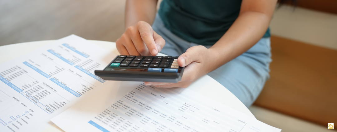 image of person using calculator in IGCSE Accounting Class for Teens at AriseHomeEducation.com