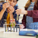 image of teens in lab studying faith-based biology for teens in the UK with Arise Home Education.