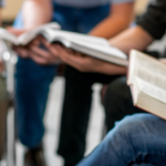 image of students preparing for Online Bible Study for Teens at Arise Home Education by studying the Bible with friends and family.